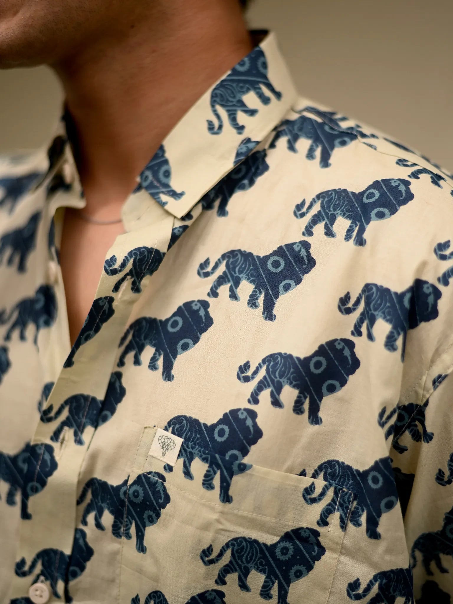 cream blue lion printed half-sleeves shirt