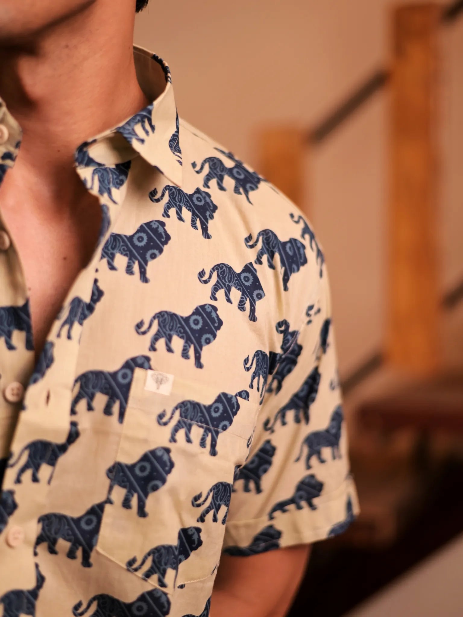 cream blue lion printed half-sleeves shirt